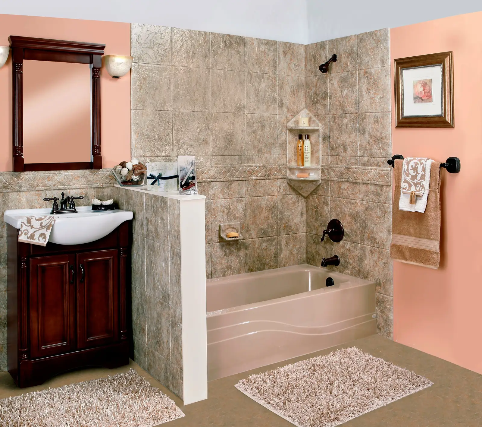 Almond bathtub with tan stone-look tile-pattern wall panels, a built-in corner shelf and a matching half wall next to a cherry vanity