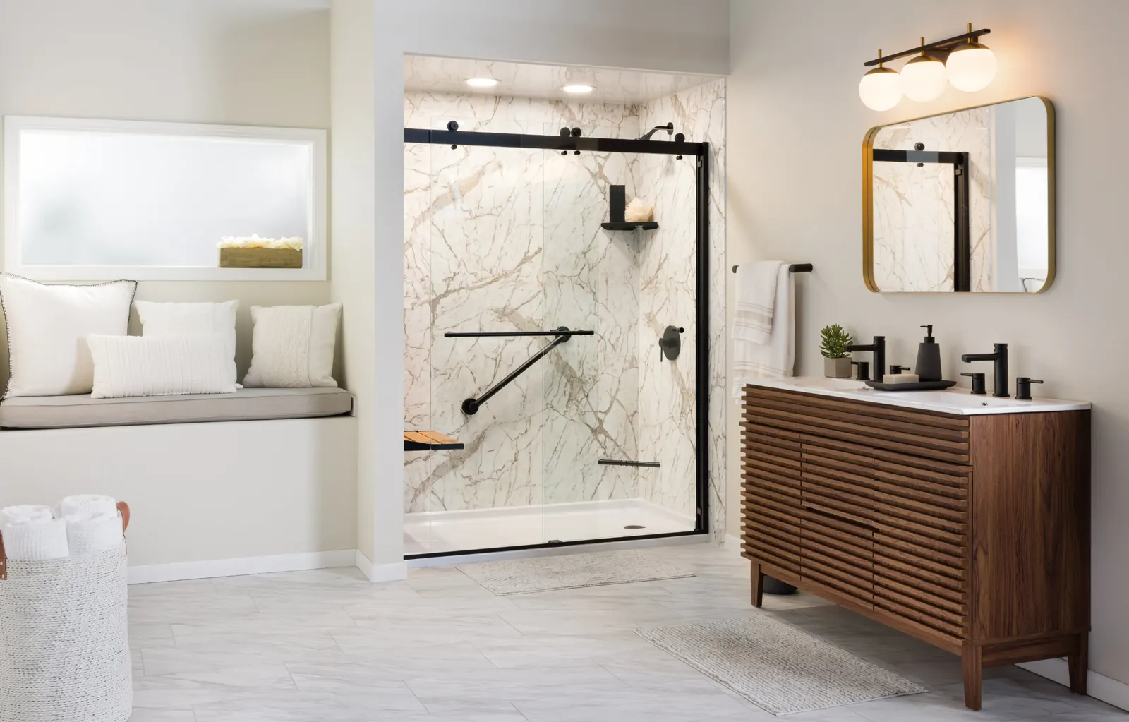 Walk-in shower with marble-look wall panels, a black-framed sliding glass door, a grab bar and a fold-down seat, next to a wood vanity